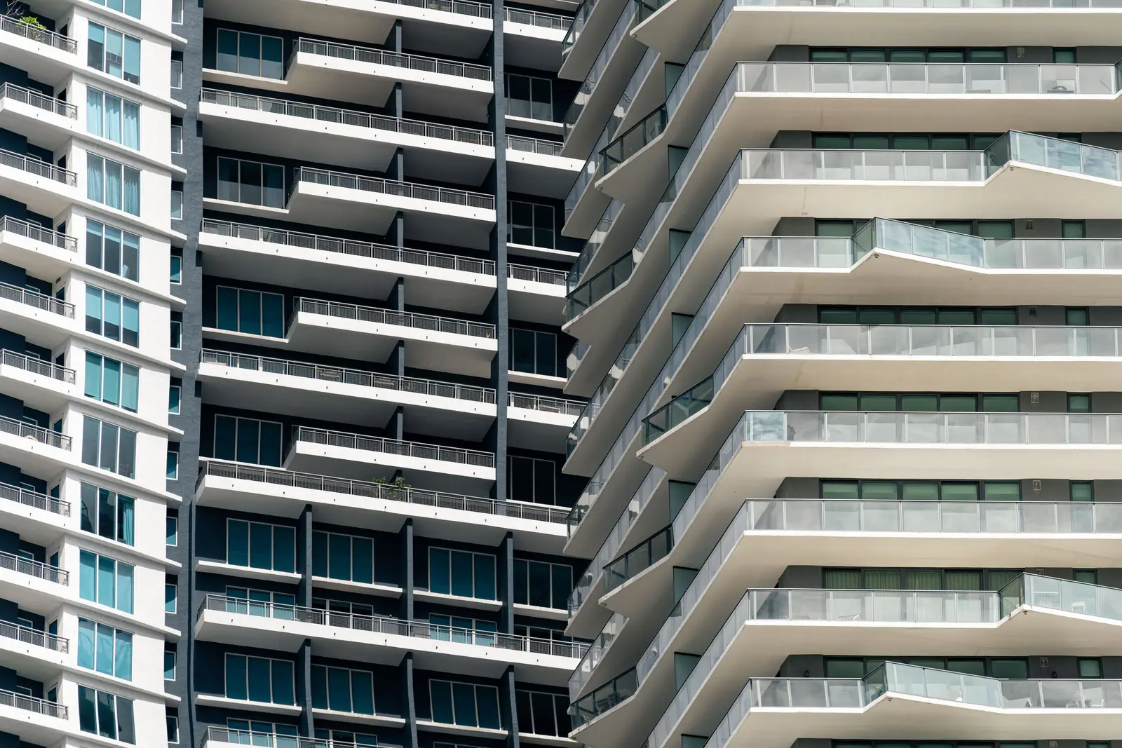 Modern condominium towers with layered balconies in Miami.